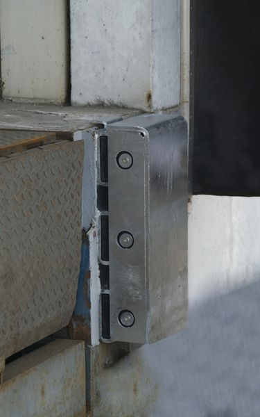 Steel-faced loading bay dock buffer