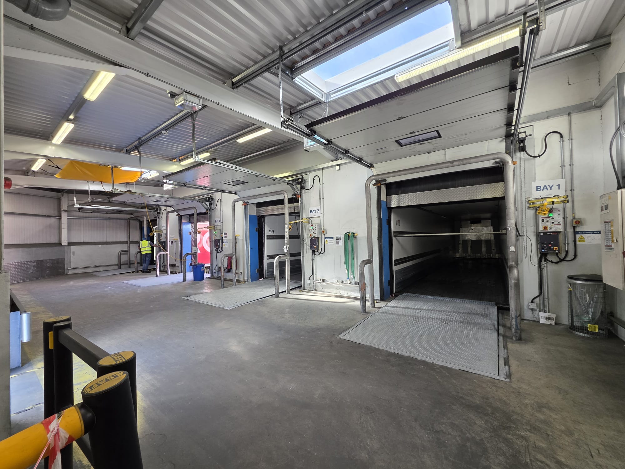 A complete loading bay system with doors, controls and dock platforms