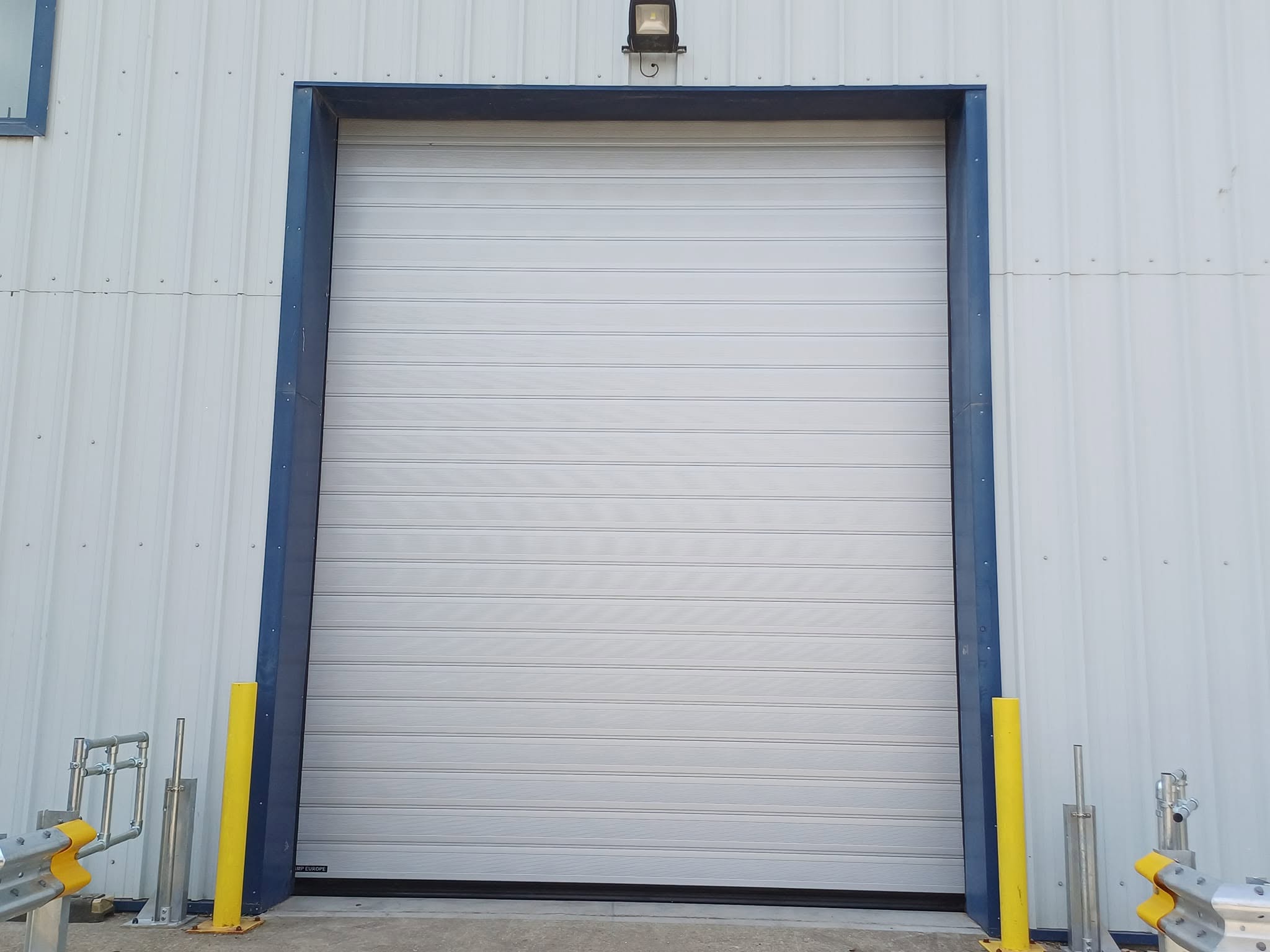 Insulated external sectional panelled door